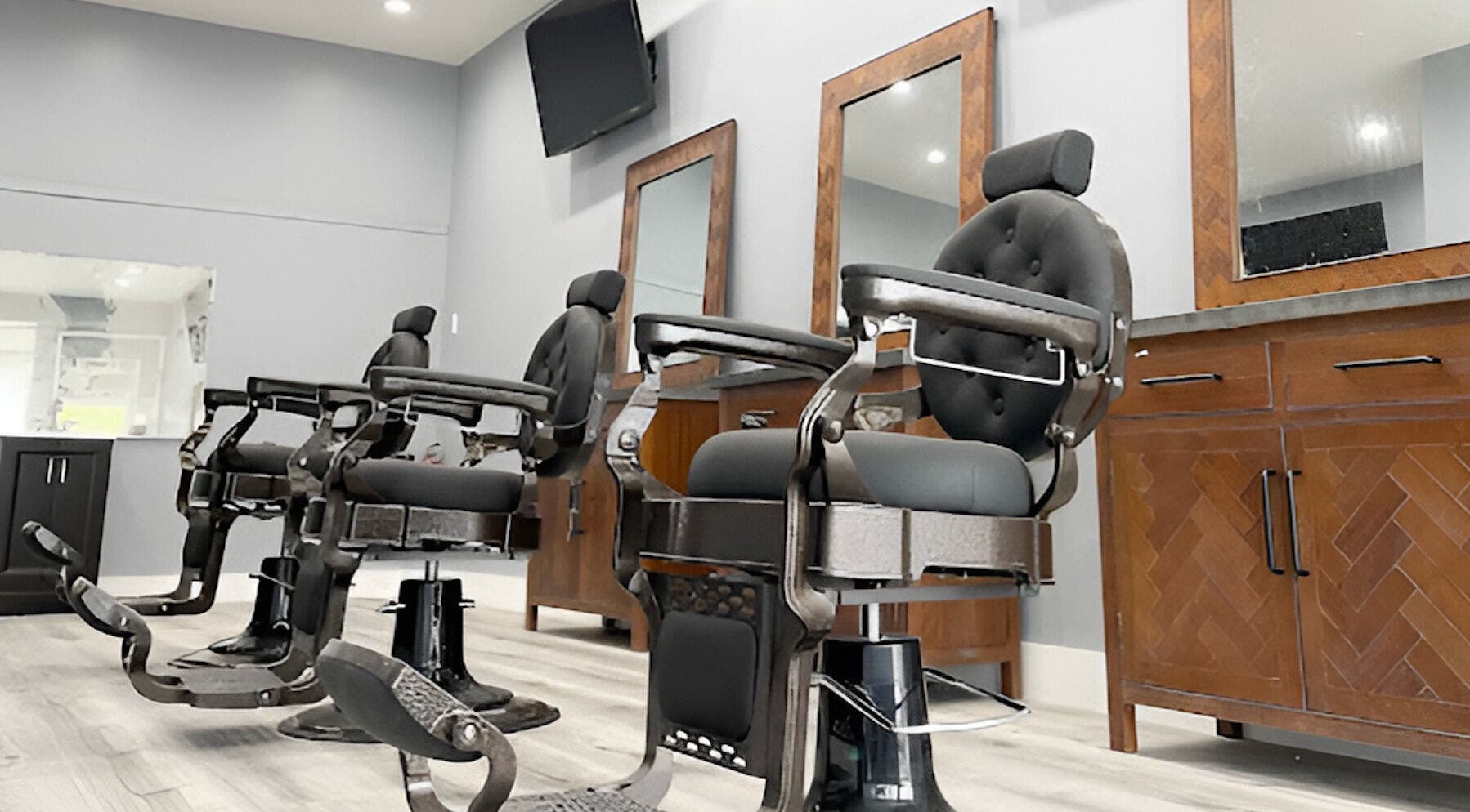 Modern barber chairs at HC Shave House in Burbank, California, US. Experience premium grooming.