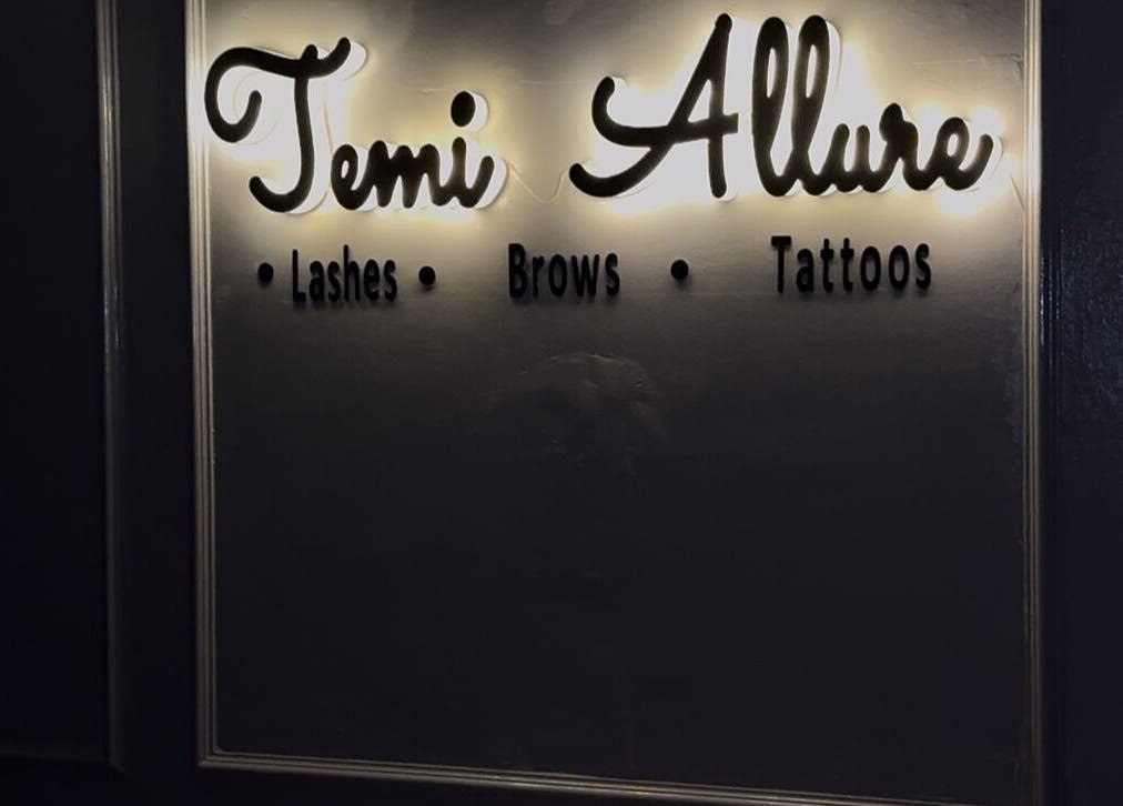 Illuminated sign at TemiAllureStudio in Lagos, Lagos, NG showcasing lashes, brows, tattoos.