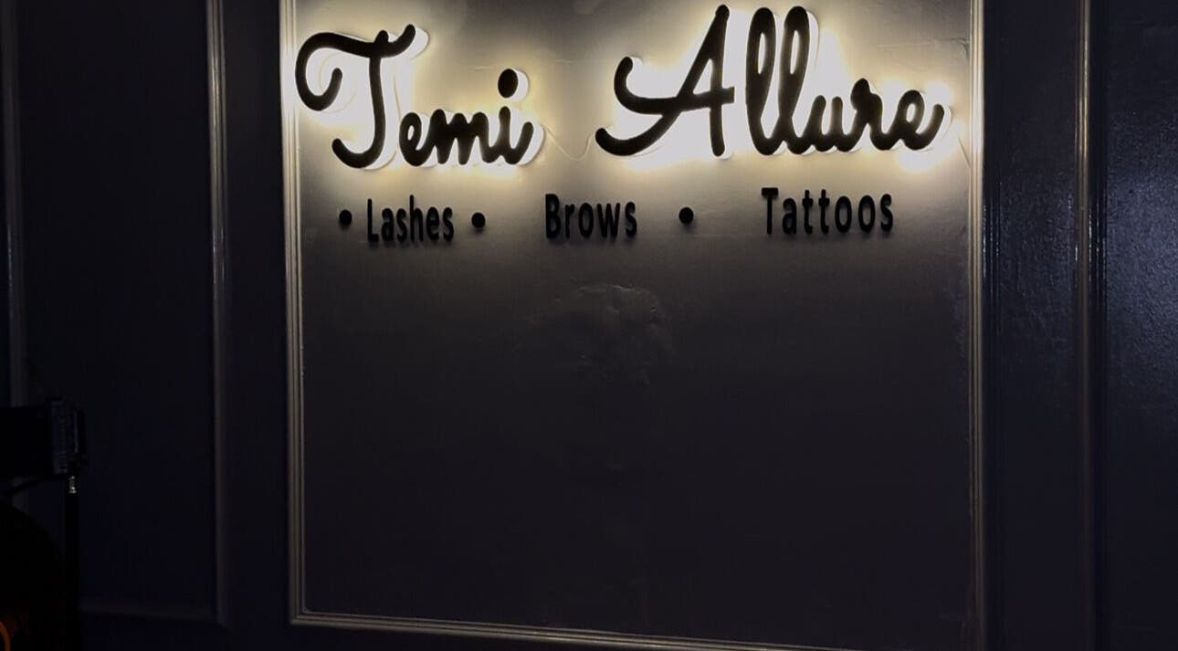Illuminated sign at TemiAllureStudio in Lagos, Lagos, NG showcasing lashes, brows, tattoos.