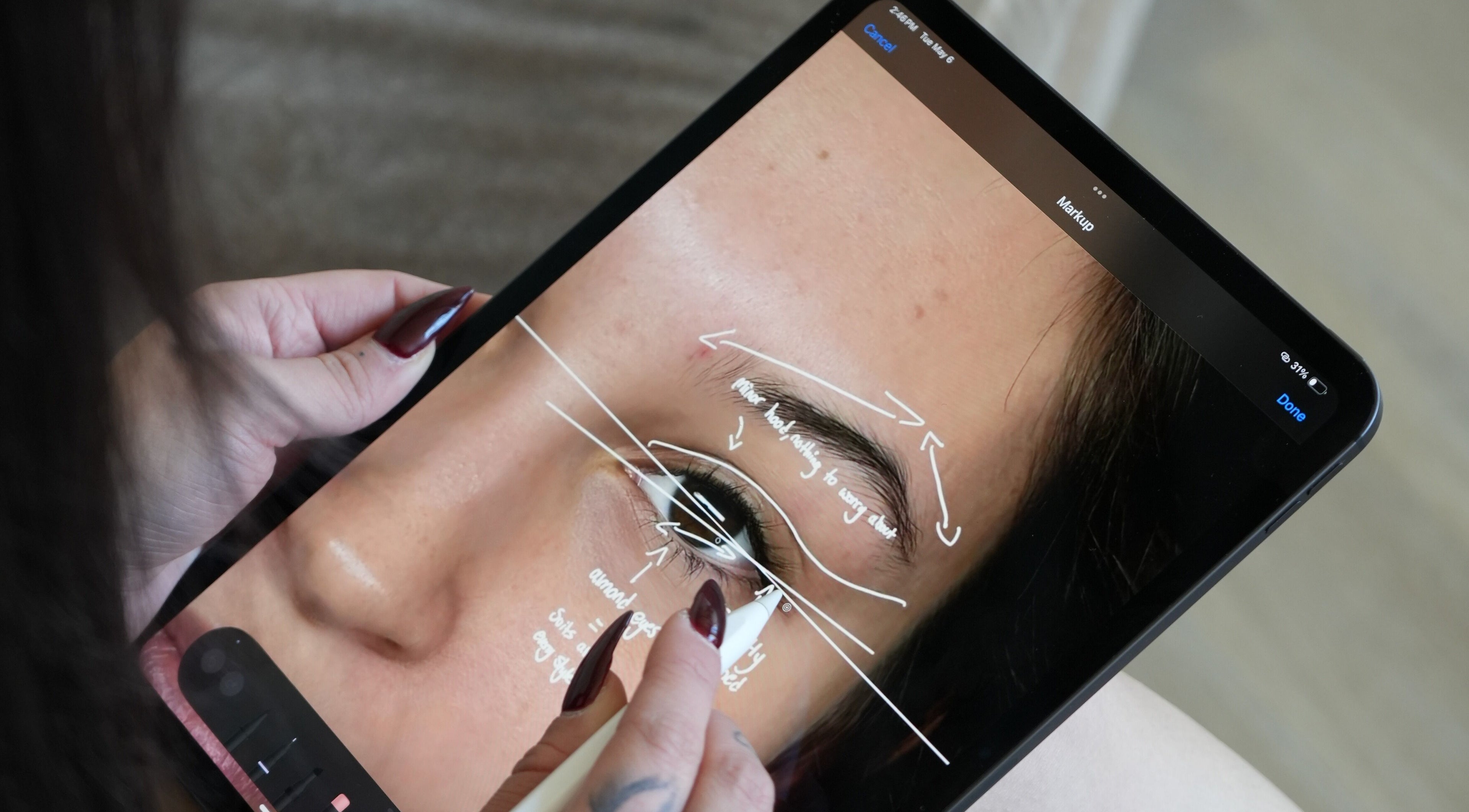 Close-up of brow styling notes on tablet at Lash Her by Nataliea, Toronto, Ontario, CA.