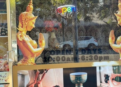 Entrance of Siam Kinnaree Thai Massage in Fremantle, WA, featuring elegant golden statues.