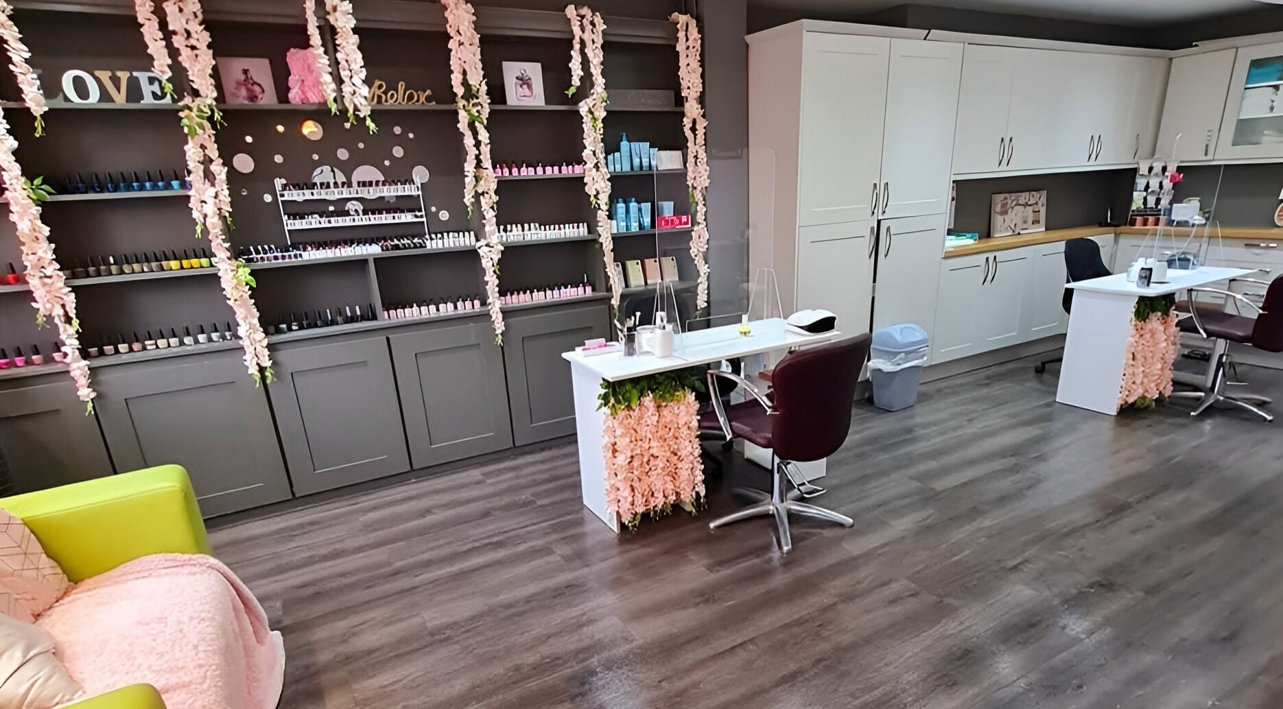 Elegant nail salon at Sarah's Nails and Beauty, Cadishead, England, with floral decor and stylish workstations.