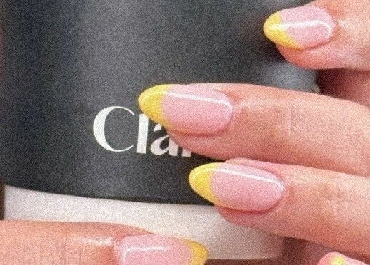Elegant pink and yellow manicure holding Clarity Spa cup at Clarity Spa | كلارتي سبا, Riyadh, Riyadh Province, SA.