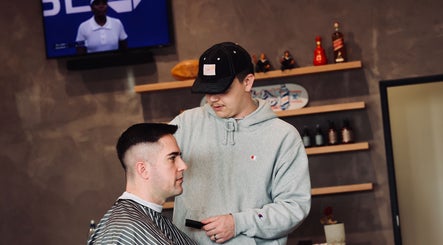 Barber crafting a modern haircut at Boar and Blade Ponsonby, Auckland, Auckland, NZ.