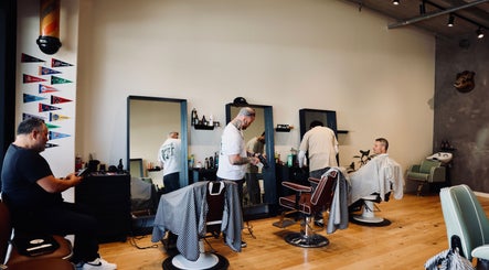 Stylish barbershop interior at Boar and Blade Ponsonby, Auckland, Auckland, NZ with clients and barbers.
