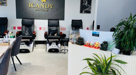 Chic interior of ICandy Boutique in Auckland, NZ, featuring plush spa chairs and elegant decor.