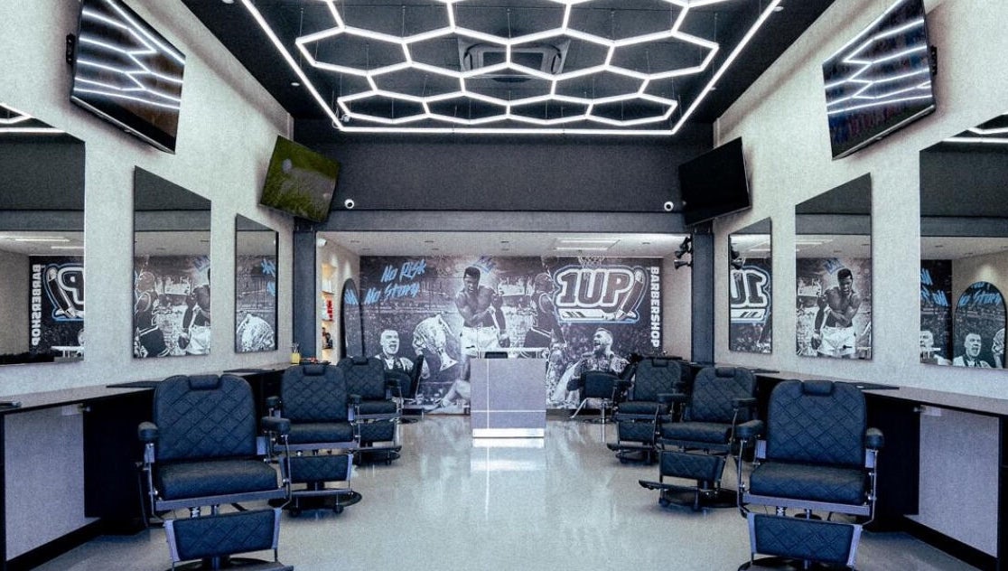 Modern interior of 1UP Barbershop Bicton, featuring stylish chairs and decor in Bicton, Western Australia, AU.