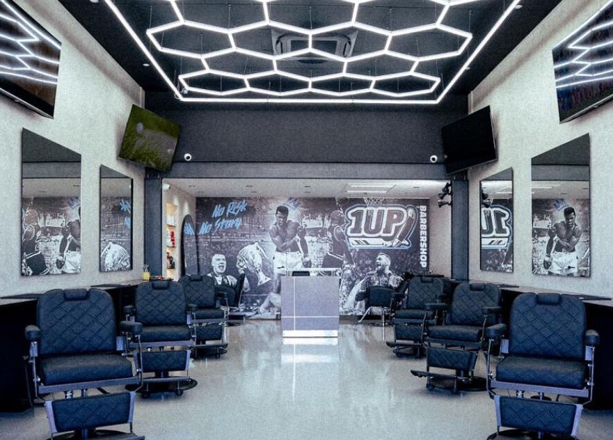 Modern interior of 1UP Barbershop Bicton, featuring stylish chairs and decor in Bicton, Western Australia, AU.