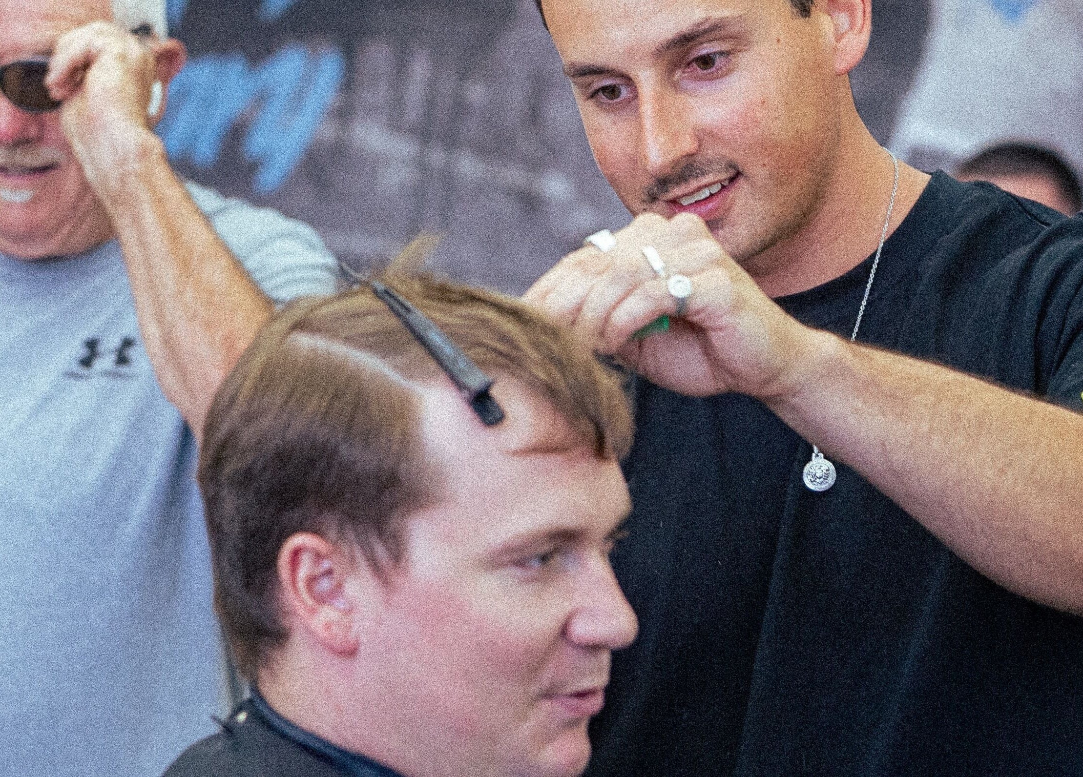 Stylist giving a haircut at 1UP Barbershop Bicton in Bicton, Western Australia, AU.