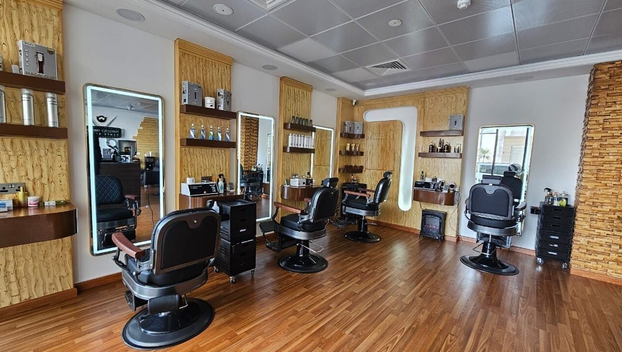 Interior of Perfectly Trimmed Gents Salon, Abu Dhabi, AE featuring sleek barber chairs and modern decor.