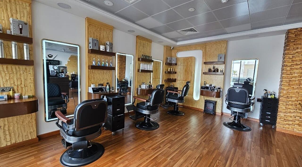 Interior of Perfectly Trimmed Gents Salon, Abu Dhabi, AE featuring sleek barber chairs and modern decor.