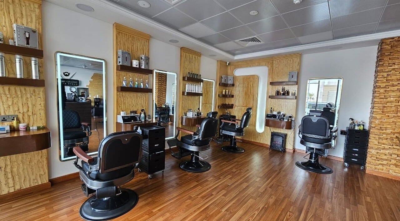 Interior of Perfectly Trimmed Gents Salon, Abu Dhabi, AE featuring sleek barber chairs and modern decor.