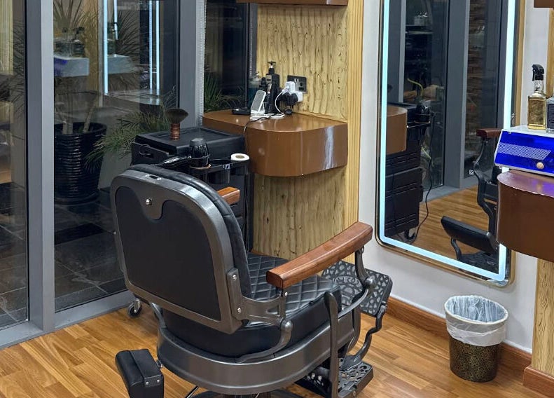 Stylish barber chair and station at Perfectly Trimmed Gents Salon, Abu Dhabi, Abu Dhabi, AE.