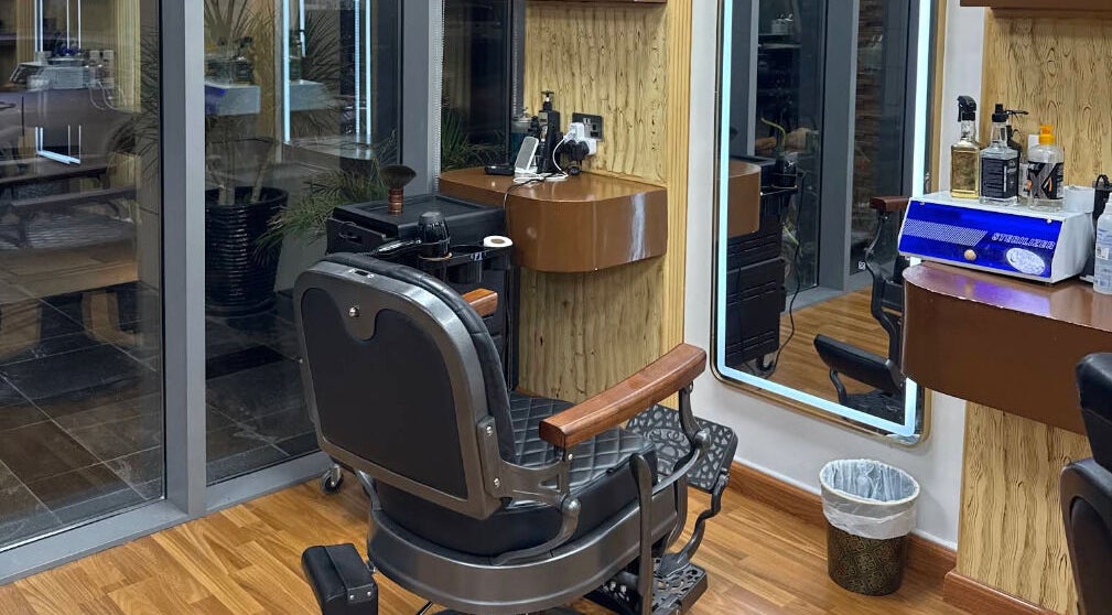 Stylish barber chair and station at Perfectly Trimmed Gents Salon, Abu Dhabi, Abu Dhabi, AE.