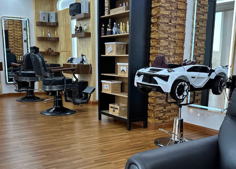 Modern interior of Perfectly Trimmed Gents Salon in Abu Dhabi, Abu Dhabi, AE, featuring stylish barber chairs and decor.