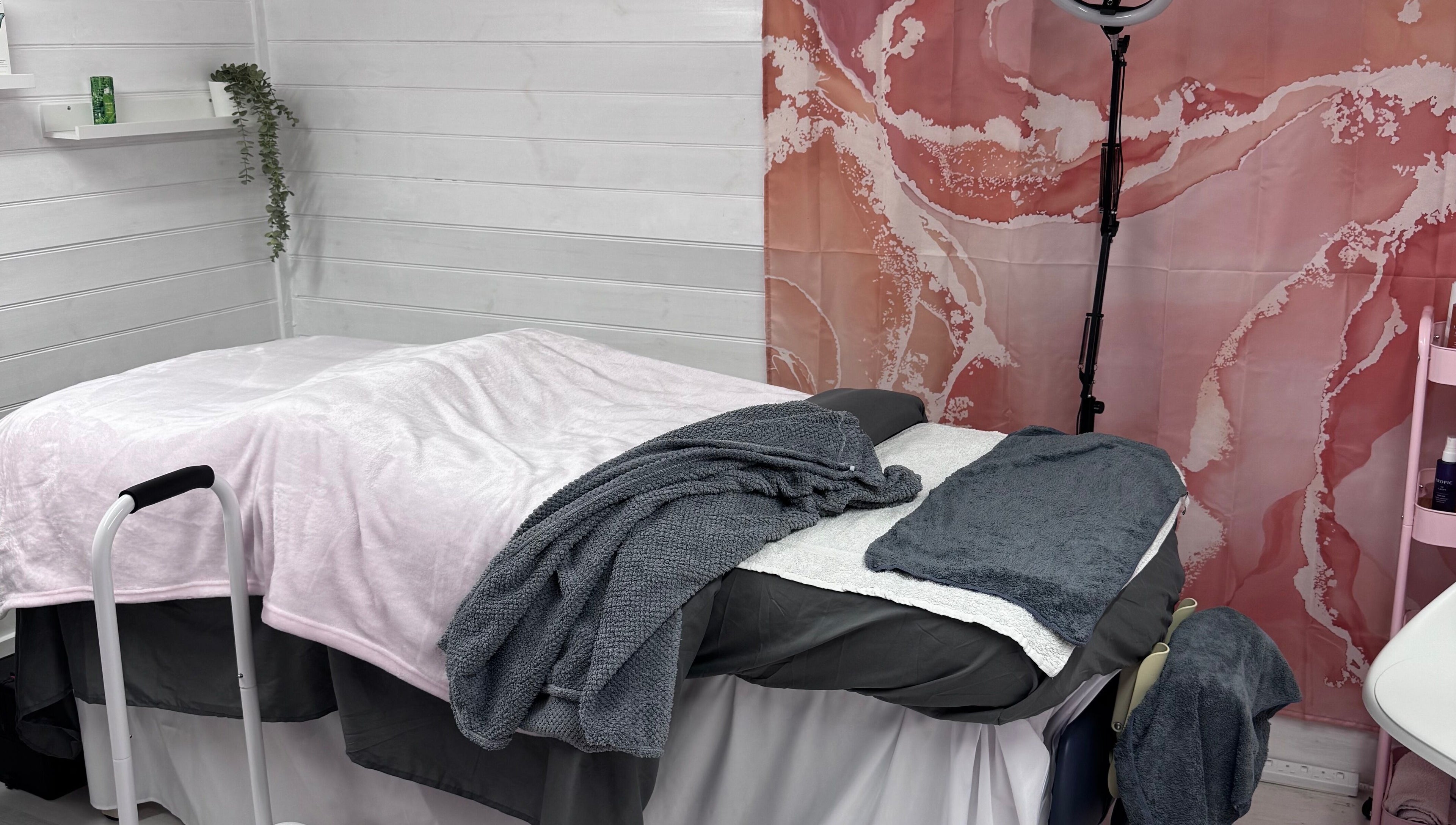 Cozy treatment room with soft blankets at The Happy Skin Technician, Sheffield, England, GB.