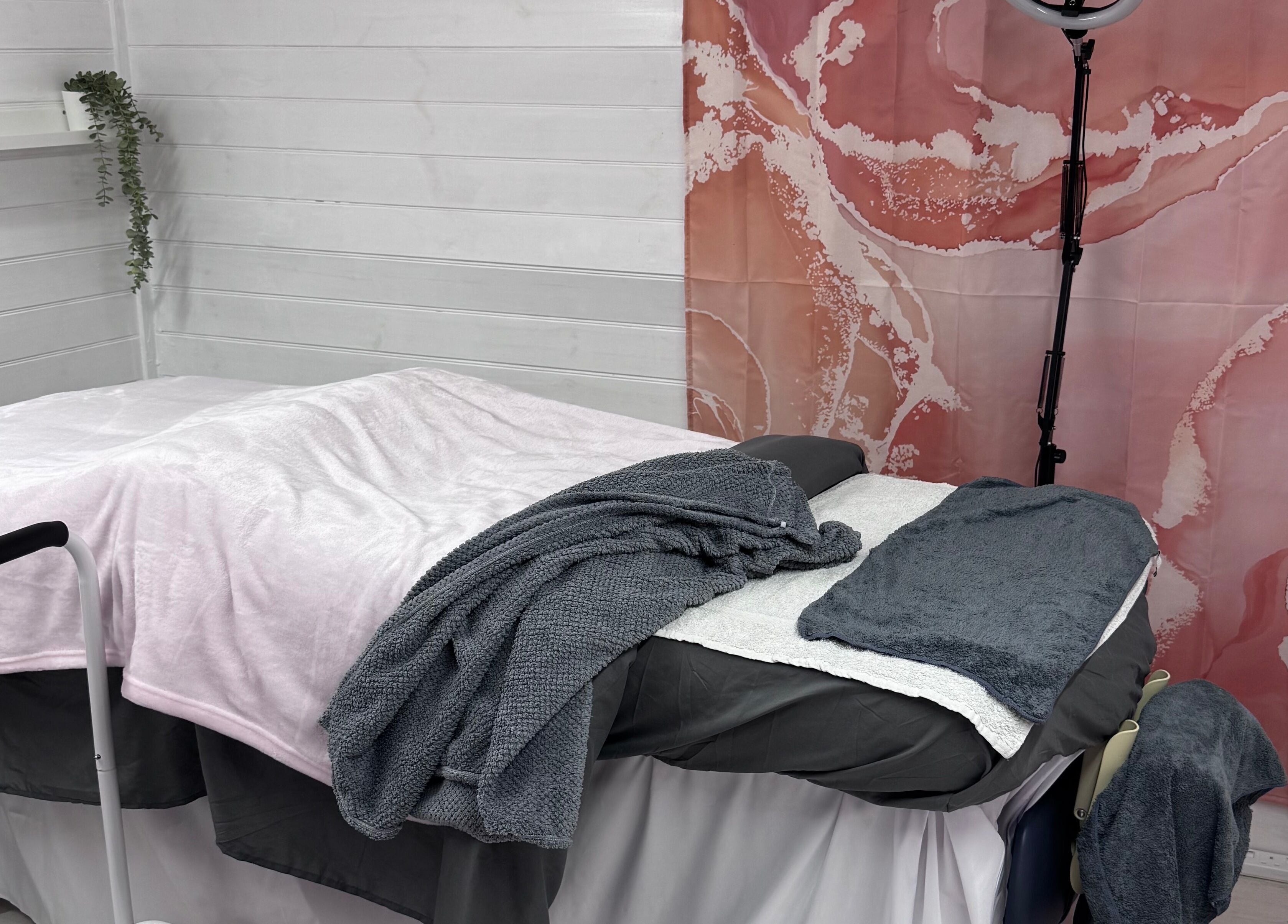 Cozy treatment room with soft blankets at The Happy Skin Technician, Sheffield, England, GB.