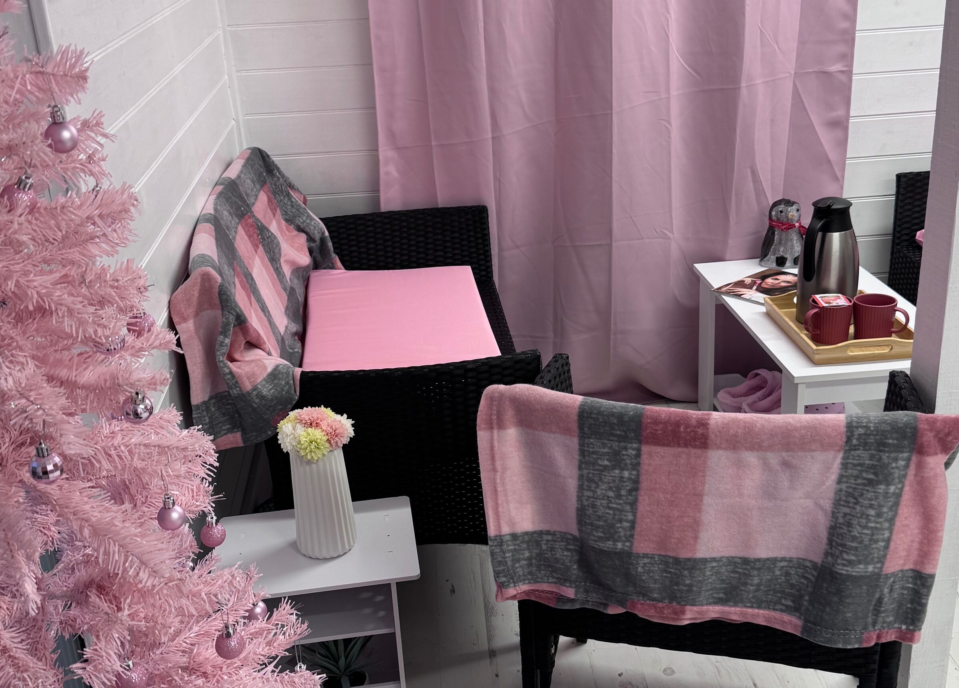 Comfortable seating at The Happy Skin Technician, Sheffield, England, GB with pink decor and refreshments.