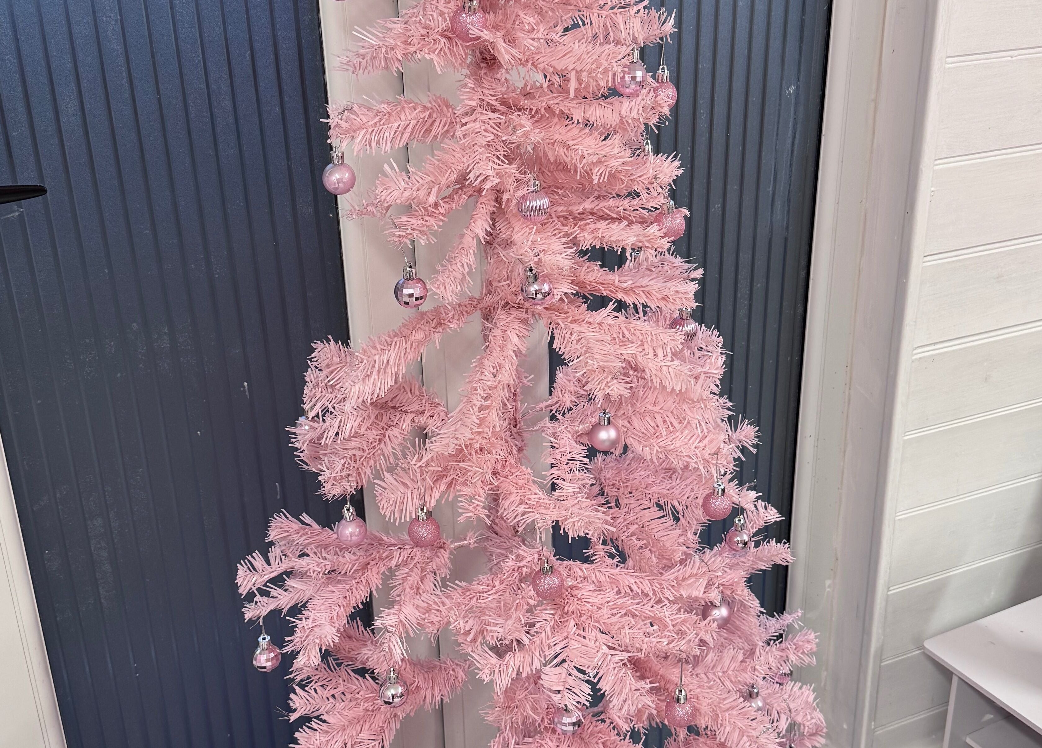 Chic pink Christmas tree at The Happy Skin Technician, Sheffield, England, GB showcasing festive decor.