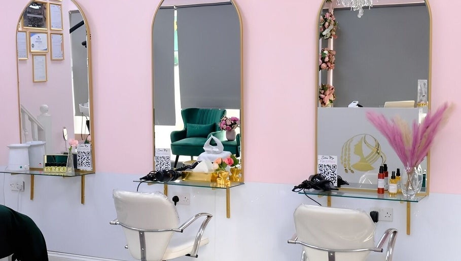 Modern salon stations at City of London Beauty Academy ltd, London, England, GB with chic decor and mirrors.