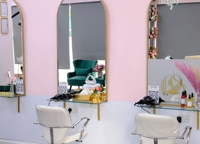 Modern salon stations at City of London Beauty Academy ltd, London, England, GB with chic decor and mirrors.