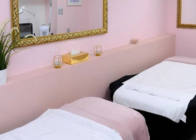 Relaxing spa room at City of London Beauty Academy ltd in London, England, GB with twin treatment beds and elegant decor.