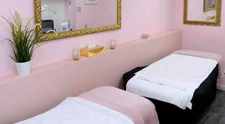 Relaxing spa room at City of London Beauty Academy ltd in London, England, GB with twin treatment beds and elegant decor.