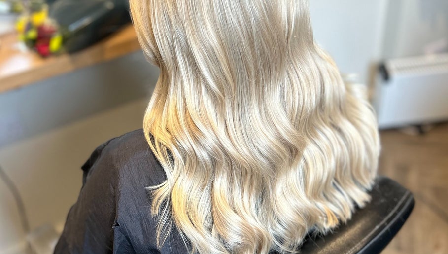 Blonde hair with soft waves styled at Gina Marks Hair in Elmswell, England, GB.