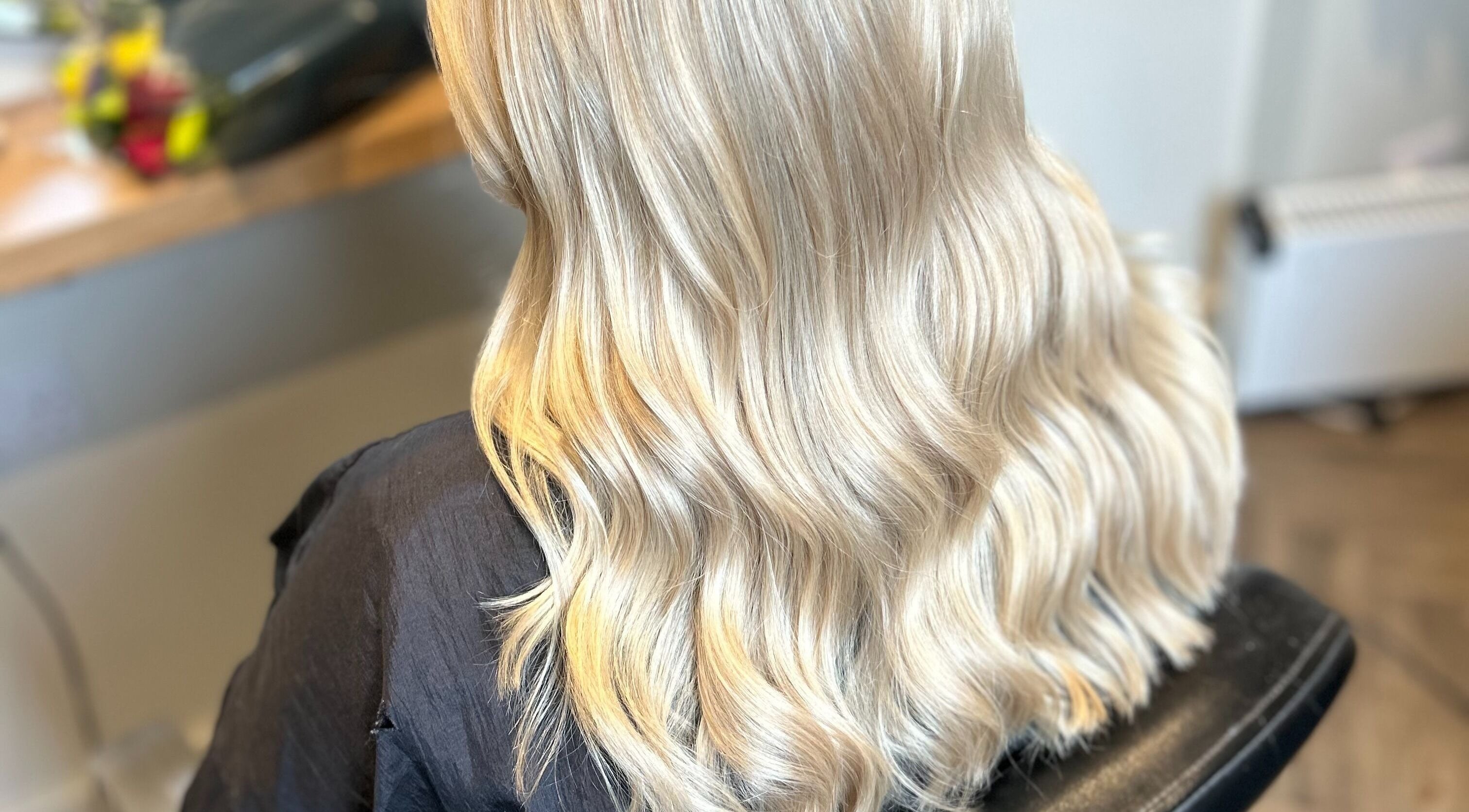 Blonde hair with soft waves styled at Gina Marks Hair in Elmswell, England, GB.