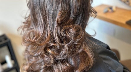 Stylish curly hair at Gina Marks Hair in Elmswell, England, GB showcasing professional hairstyling.