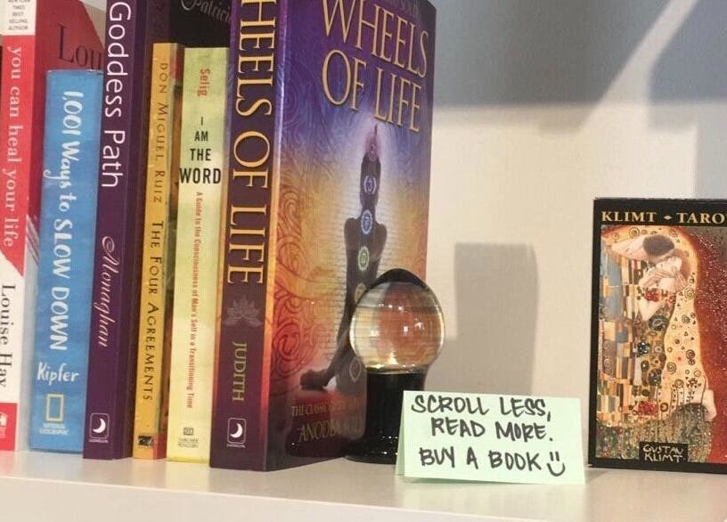 Diverse holistic books and a crystal at CoalitionSkin | Holistic Spa Downtown Vancouver, Vancouver, British Columbia, CA.