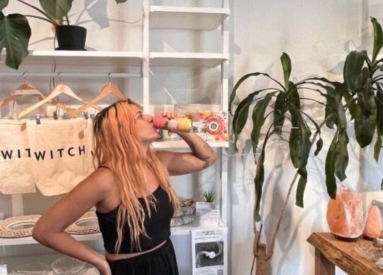 Visitor enjoying a refreshing drink at CoalitionSkin | Holistic Spa Downtown Vancouver, Vancouver, British Columbia, CA.