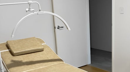 Modern therapy bed at Muse in Vasse, Vasse, Western Australia, AU, showcasing a serene treatment space.