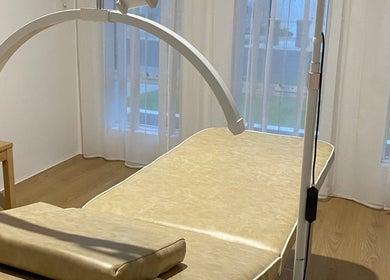Relaxing treatment room at Muse in Vasse, Vasse, Western Australia, AU. Comfortable table and soft lighting.