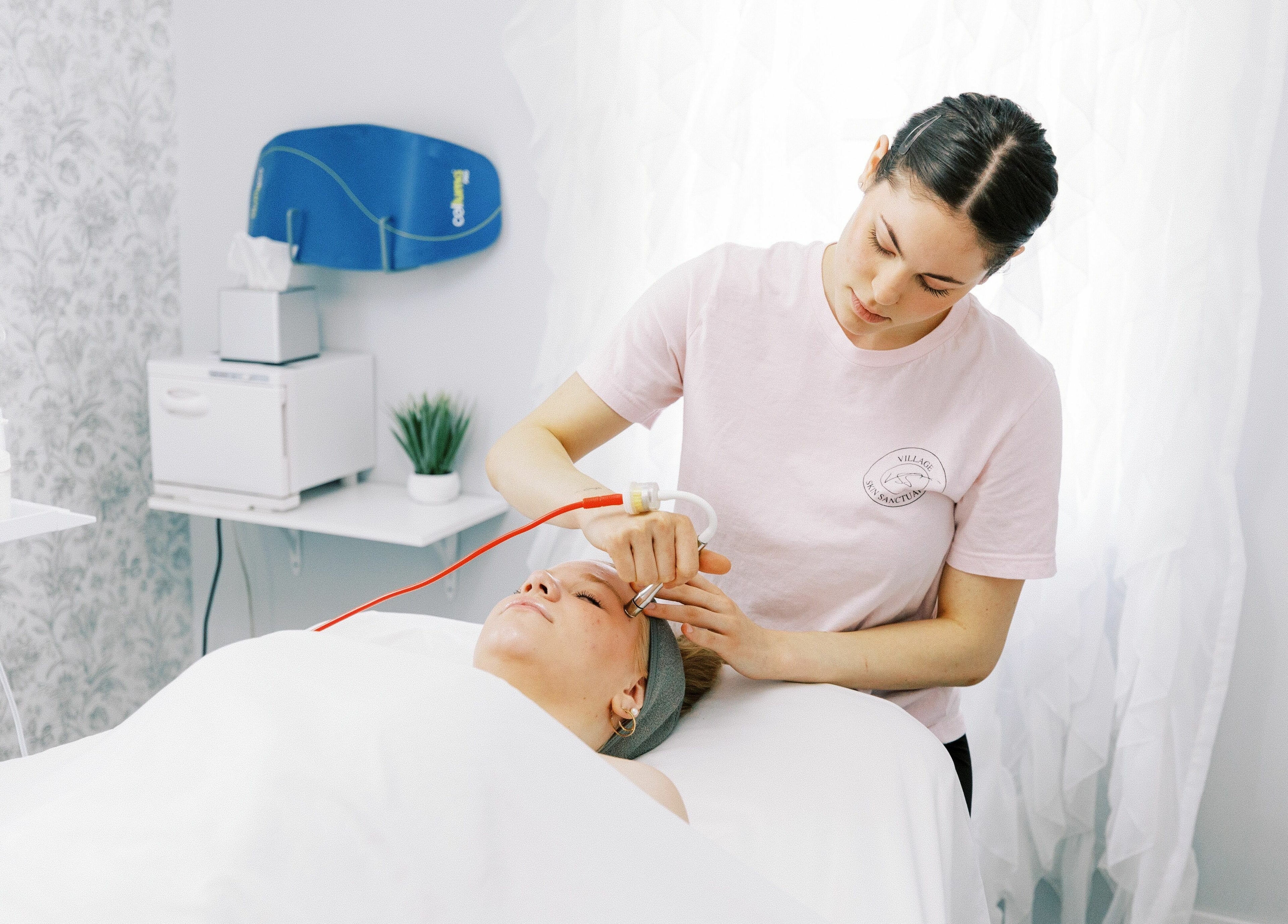 Professional facial treatment at Village Skin Sanctuary in Audubon, Pennsylvania, US, emphasizing relaxation.