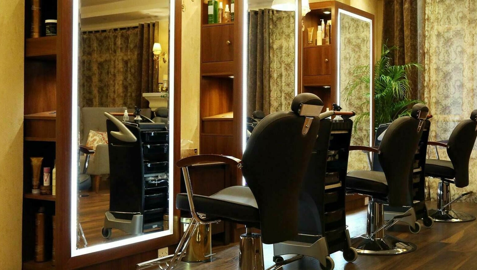 Modern salon chairs at Odel Salon, Salmiya, Hawalli Governorate, KW, in a chic, ambient setting.