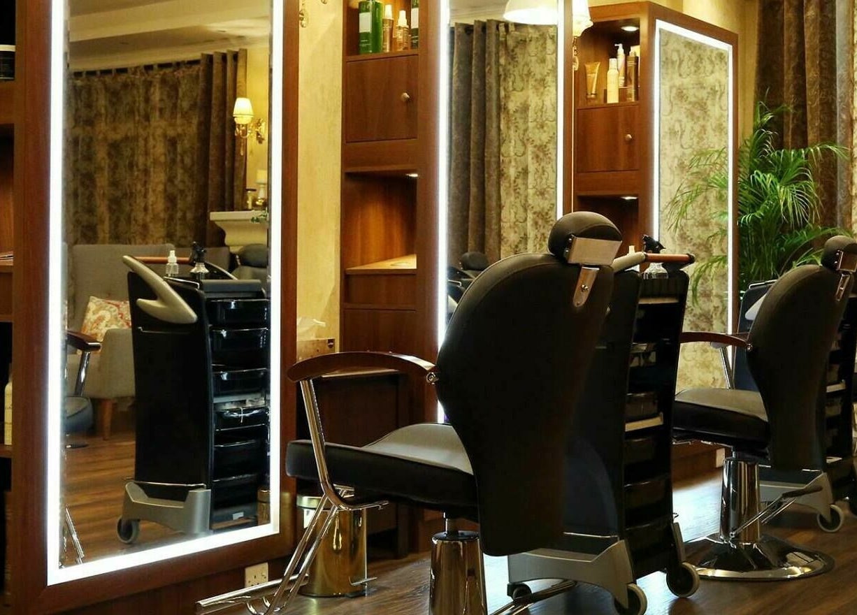 Modern salon chairs at Odel Salon, Salmiya, Hawalli Governorate, KW, in a chic, ambient setting.