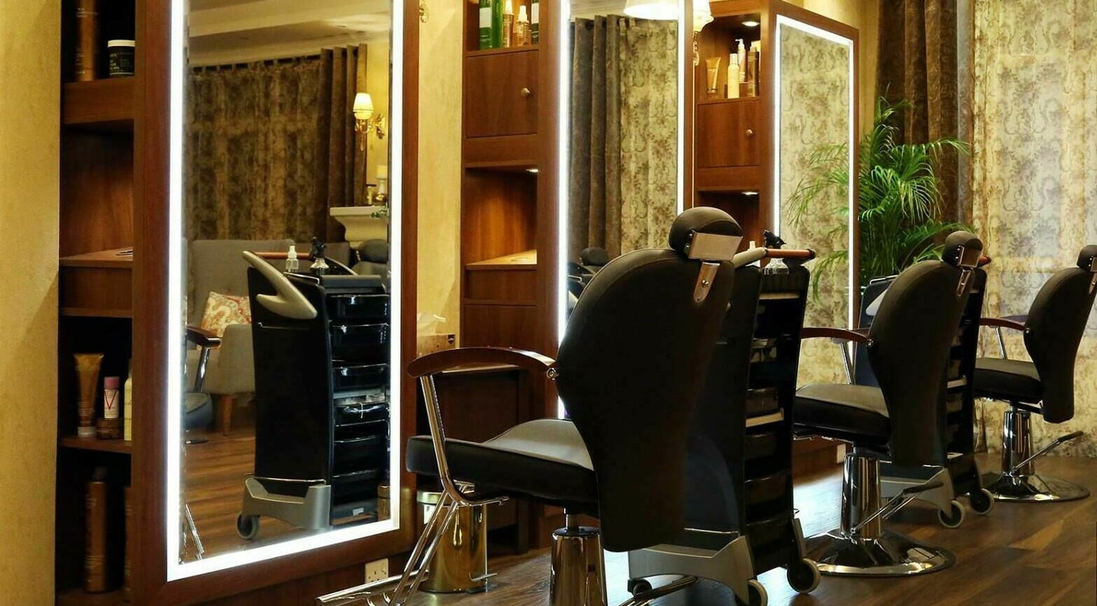 Modern salon chairs at Odel Salon, Salmiya, Hawalli Governorate, KW, in a chic, ambient setting.