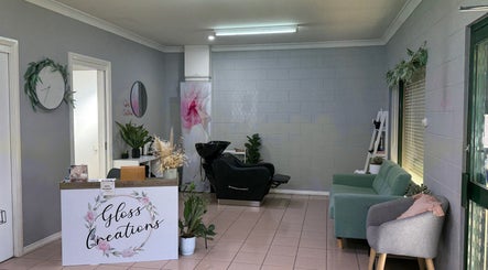 Gloss Creations salon in Wallerawang, NSW, AU showcases a cozy reception and stylish seating area.