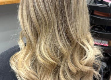 Gloss Creations salon in Wallerawang, NSW, AU showcases beautiful blonde wavy hair styling.
