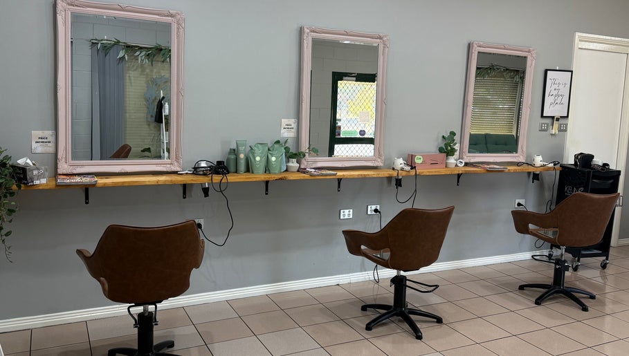 Stylish salon setup at Gloss Creations, Wallerawang, NSW, AU features chic chairs and mirrors.