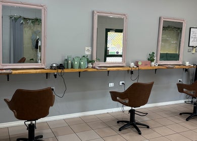 Stylish salon setup at Gloss Creations, Wallerawang, NSW, AU features chic chairs and mirrors.