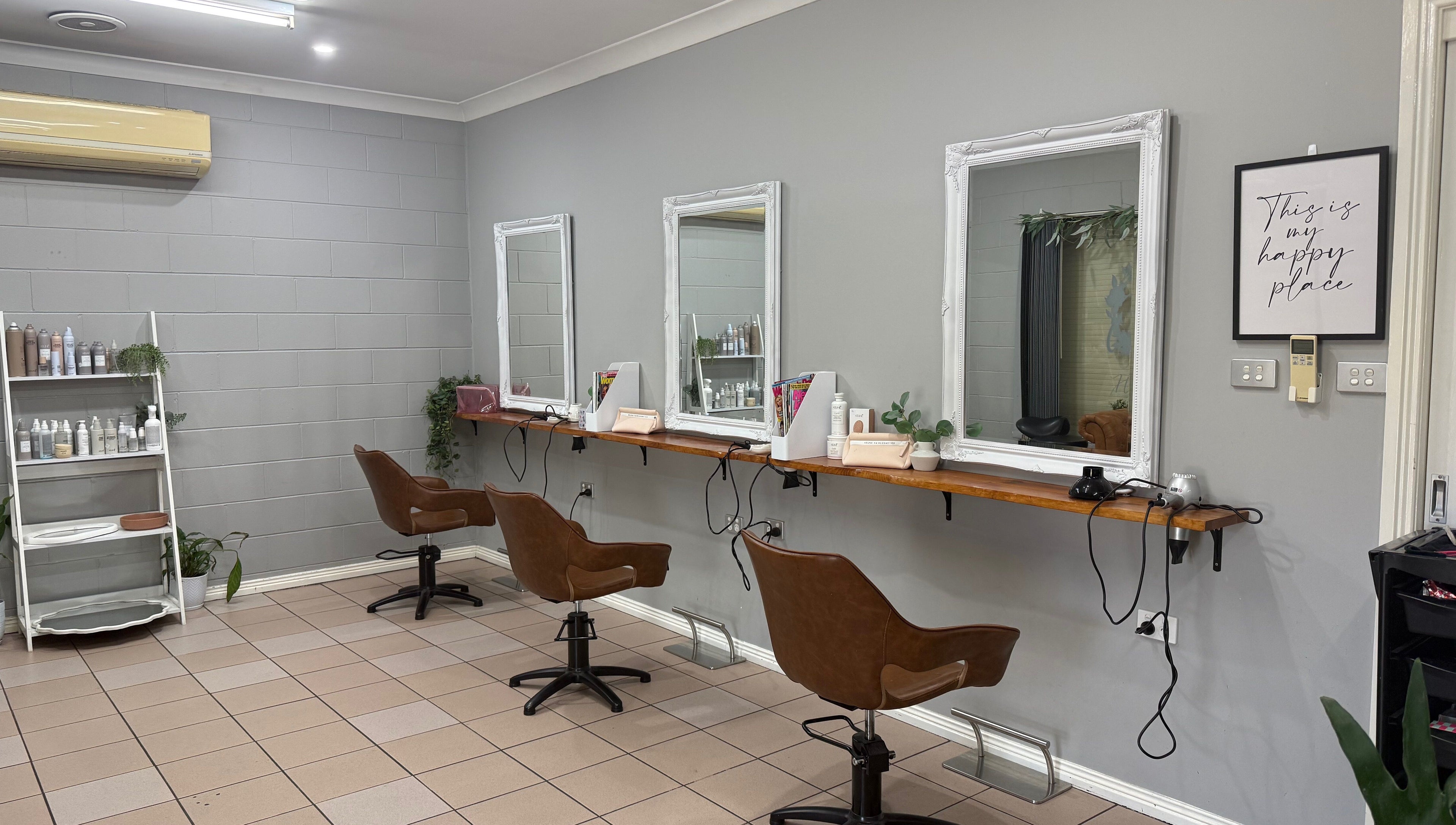 Stylish salon setup at Gloss Creations, Wallerawang, NSW, AU with chic brown chairs and elegant mirrors.