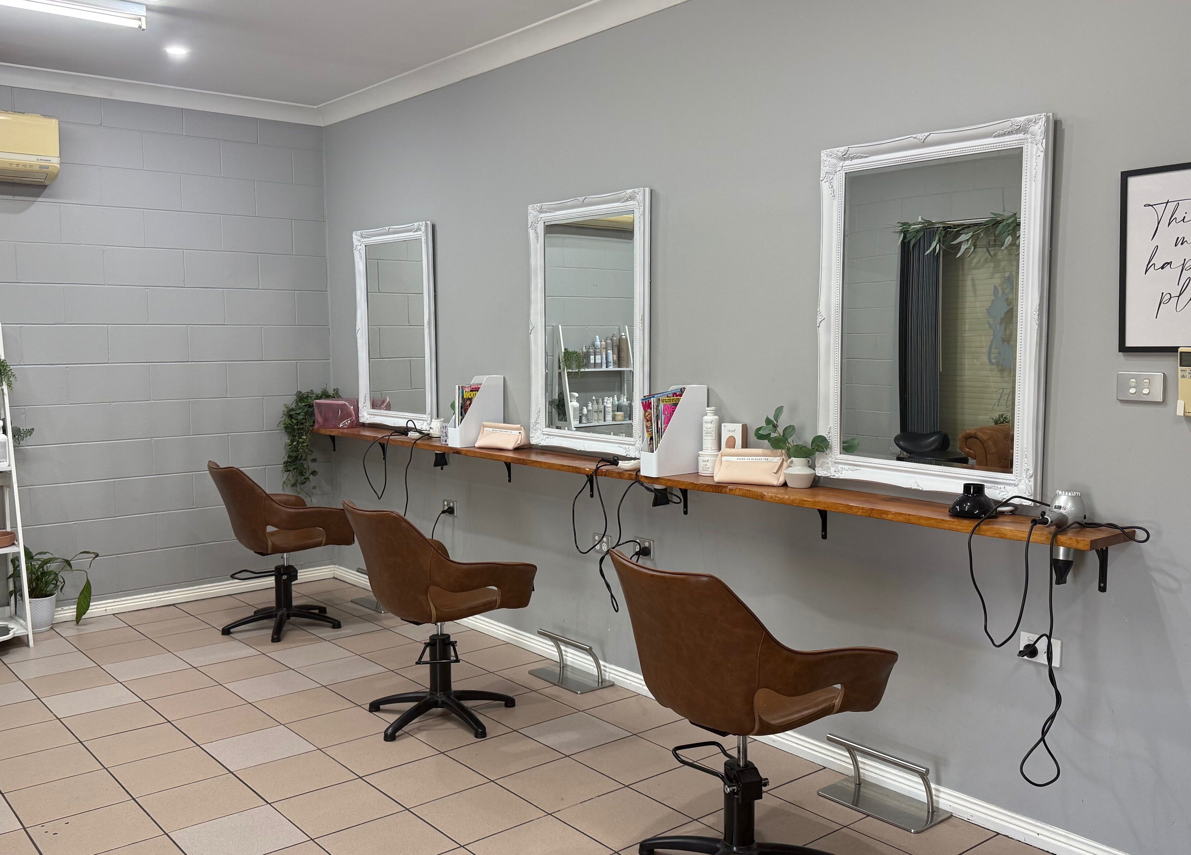 Stylish salon setup at Gloss Creations, Wallerawang, NSW, AU with chic brown chairs and elegant mirrors.