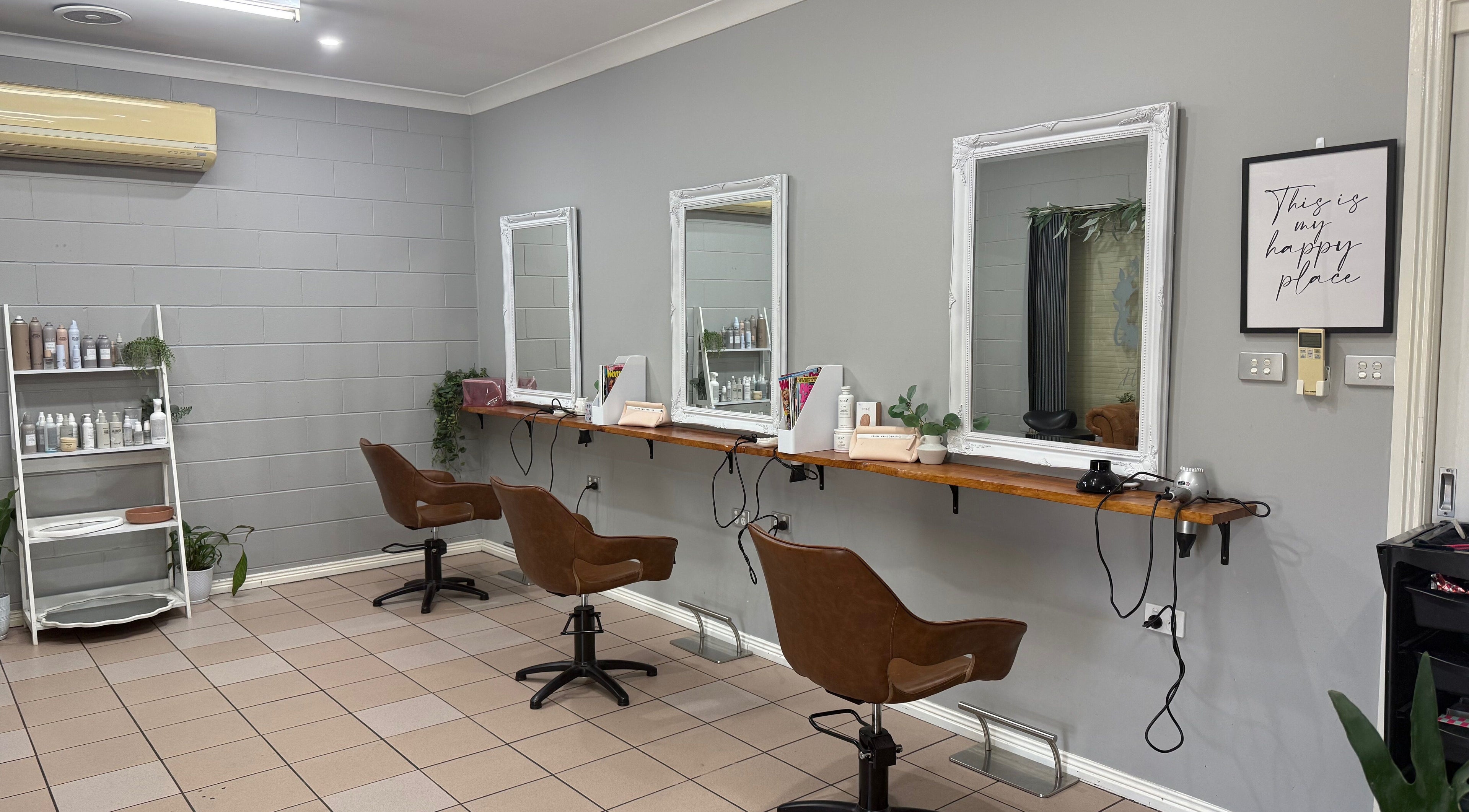 Stylish salon setup at Gloss Creations, Wallerawang, NSW, AU with chic brown chairs and elegant mirrors.