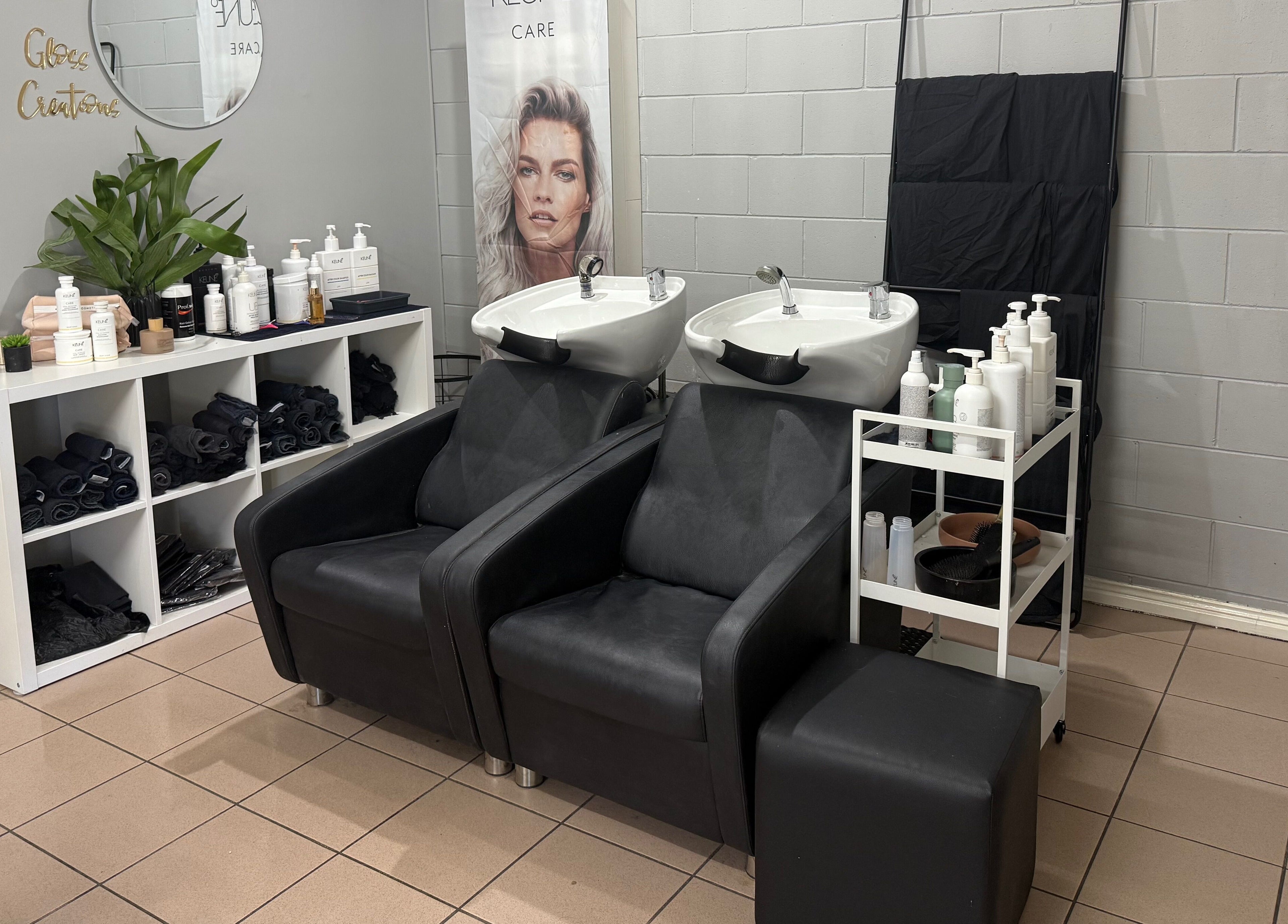 Gloss Creations hair washing station featuring sleek chairs and product display in Wallerawang, NSW, AU.