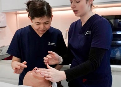 Therapists at Hurstville - Aqua Laser Clinic in Hurstville, New South Wales, AU performing facial treatment.