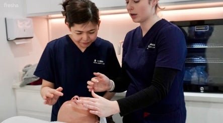 Therapists at Hurstville - Aqua Laser Clinic in Hurstville, New South Wales, AU performing facial treatment.