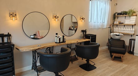 Stylish salon interior at Hair by Lauren, Ipswich, England, GB, featuring elegant chairs and decor.