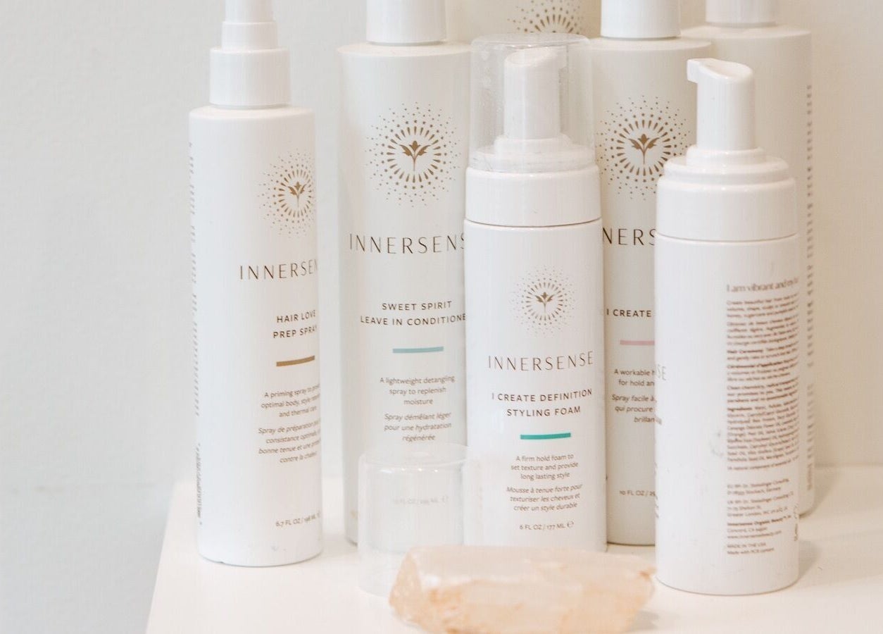 Innersense hair products displayed at Naomi Cuts Curls, Kelowna, British Columbia, CA, offering eco-friendly styling.